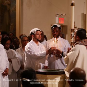Redeemer Giving of Candle at Baptism 2019 Redeemer Giving of Candle at Baptism 2019