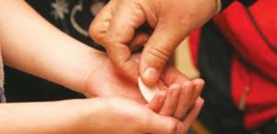 Communioin in hand
