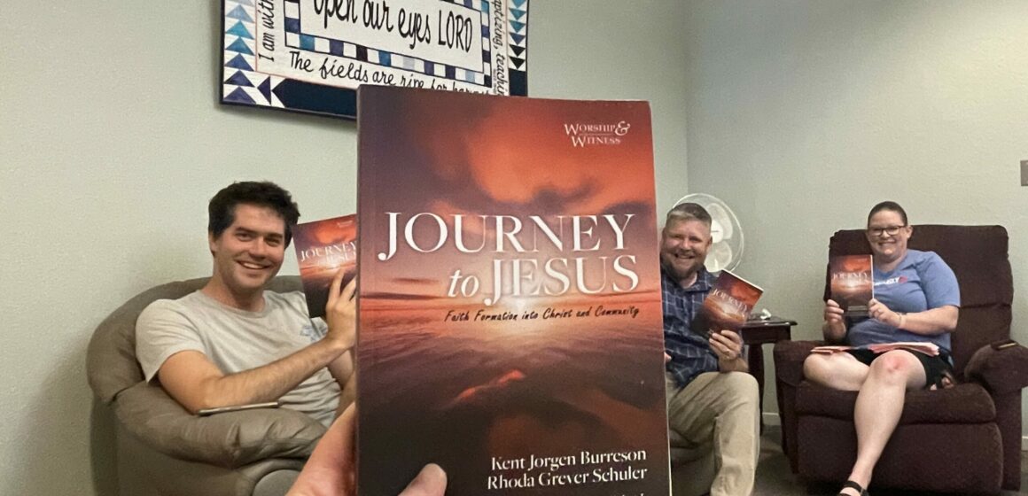 Jackie and staff with book