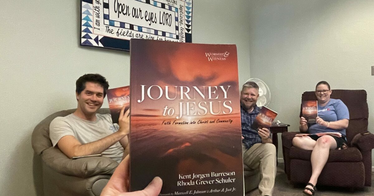 Jackie and staff with book