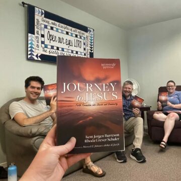 Jackie and staff with book